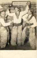 3 men, left one with gun, middle one with bottle, right one with rope postcard 1910s